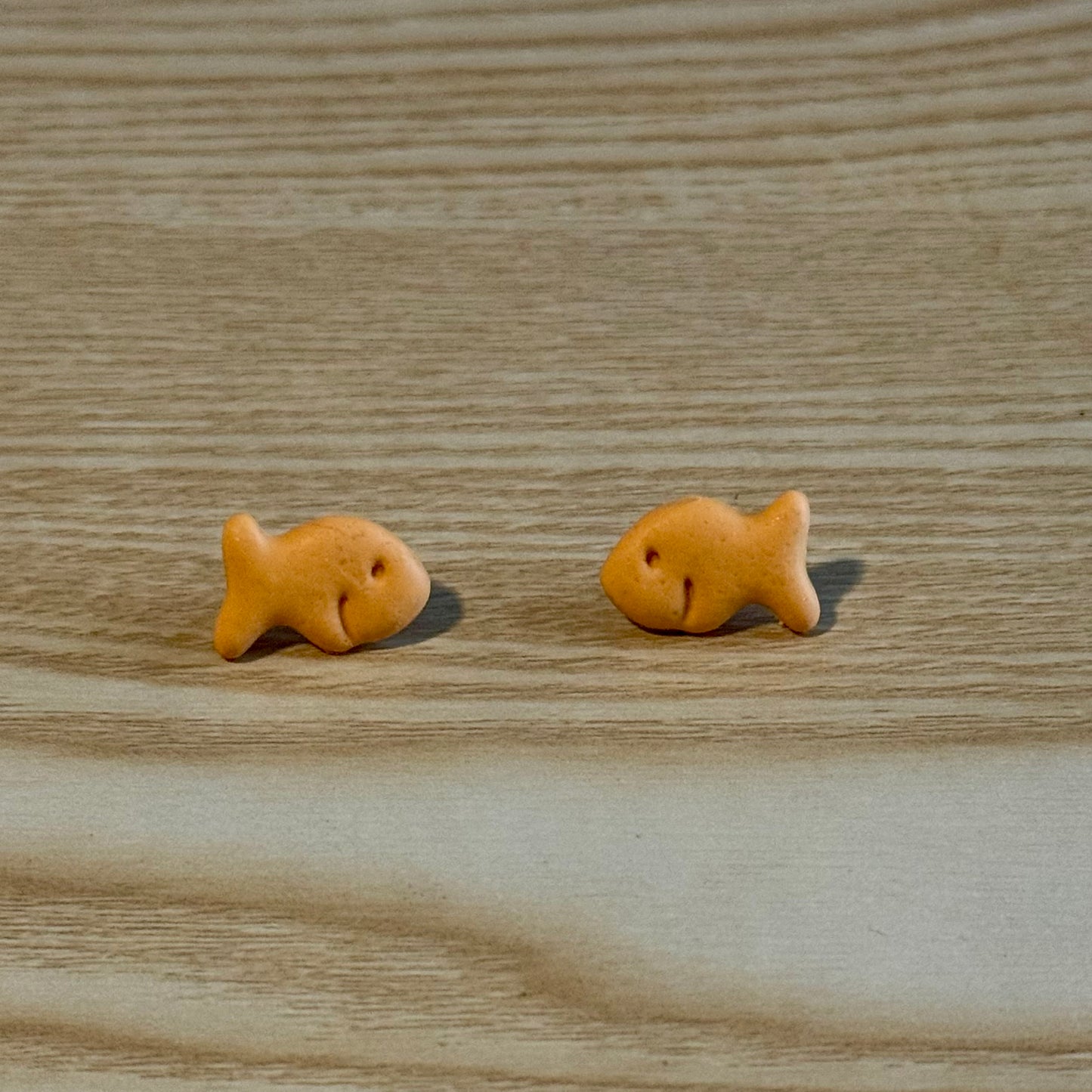 	•	goldfish cracker stud earrings handmade
	•	cute food earrings polymer clay goldfish
	•	quirky novelty stud earrings snack jewelry
	•	small goldfish earrings lightweight studs