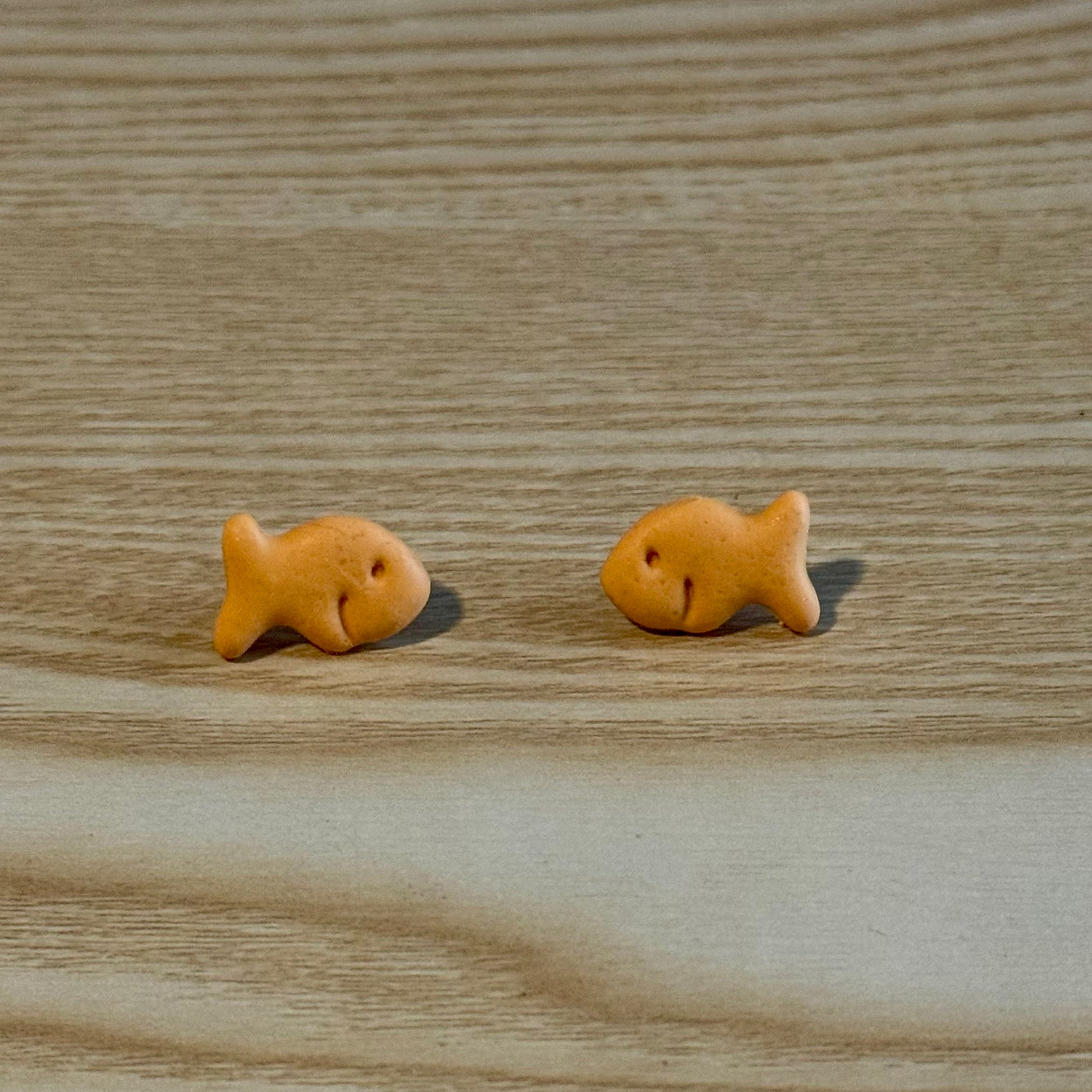 	•	goldfish cracker stud earrings handmade
	•	cute food earrings polymer clay goldfish
	•	quirky novelty stud earrings snack jewelry
	•	small goldfish earrings lightweight studs